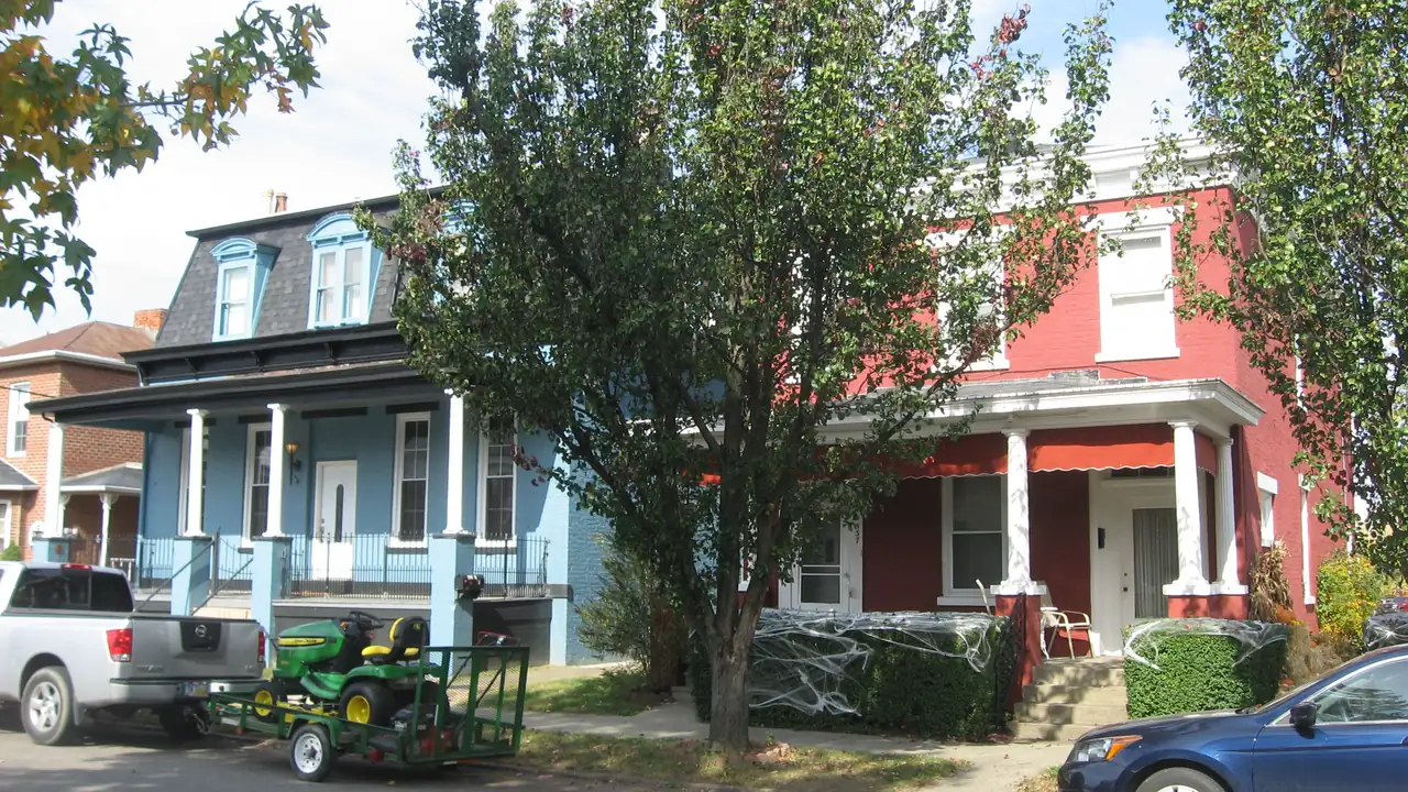 Two-story houses with porches on a tree-lined block of Sixth Street in Portsmouth, Ohio